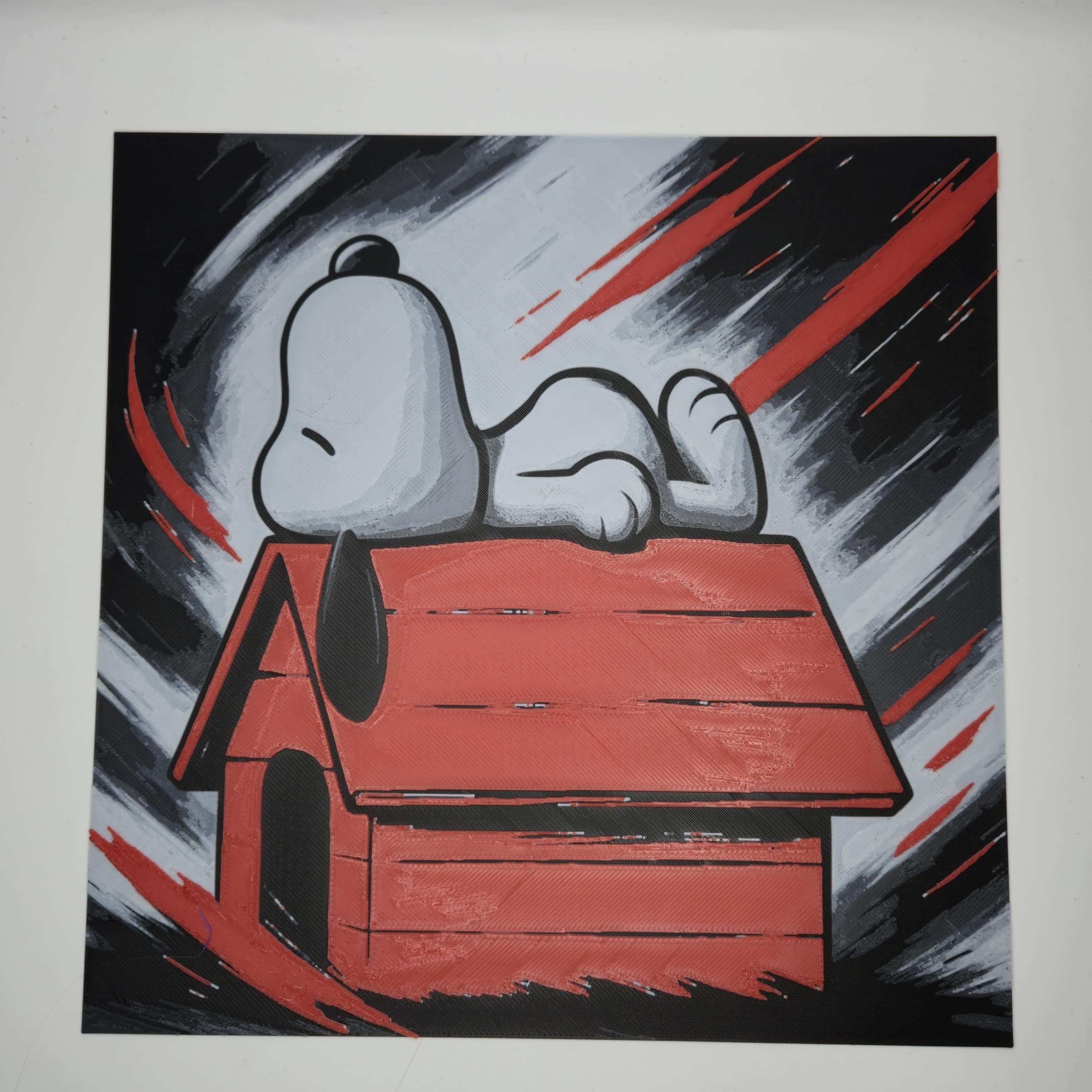 Quadro 3D Snoopy sulla cuccia – Arte multistrato con cornice nera