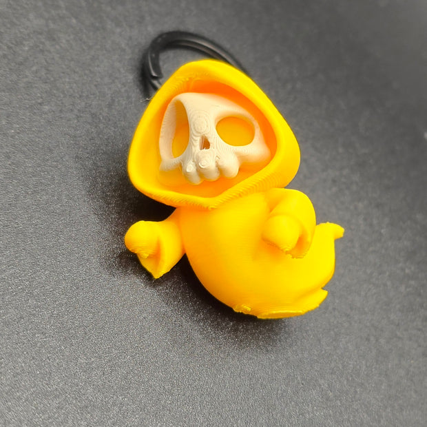 Portachiavi Halloween – Mini scheletro con cappuccio giallo